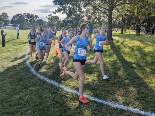 During a meet at DGS on Oct. 2, the cross country girls race against DGN and Glenbard West.
