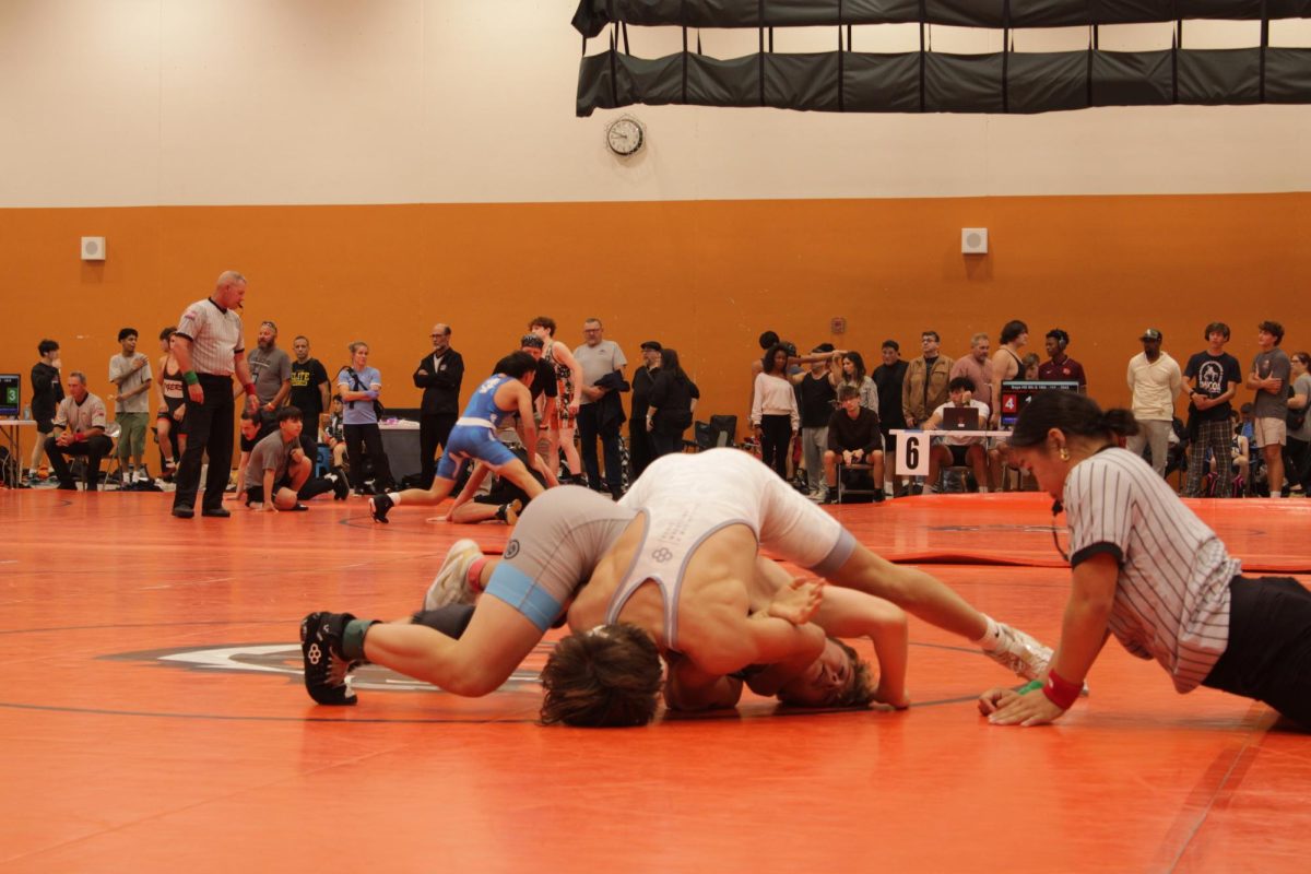 Sophomore Tommy Tyson demonstrates tackling skills, which can be applied to both Wrestling and Football. ( Sofia Tyson)