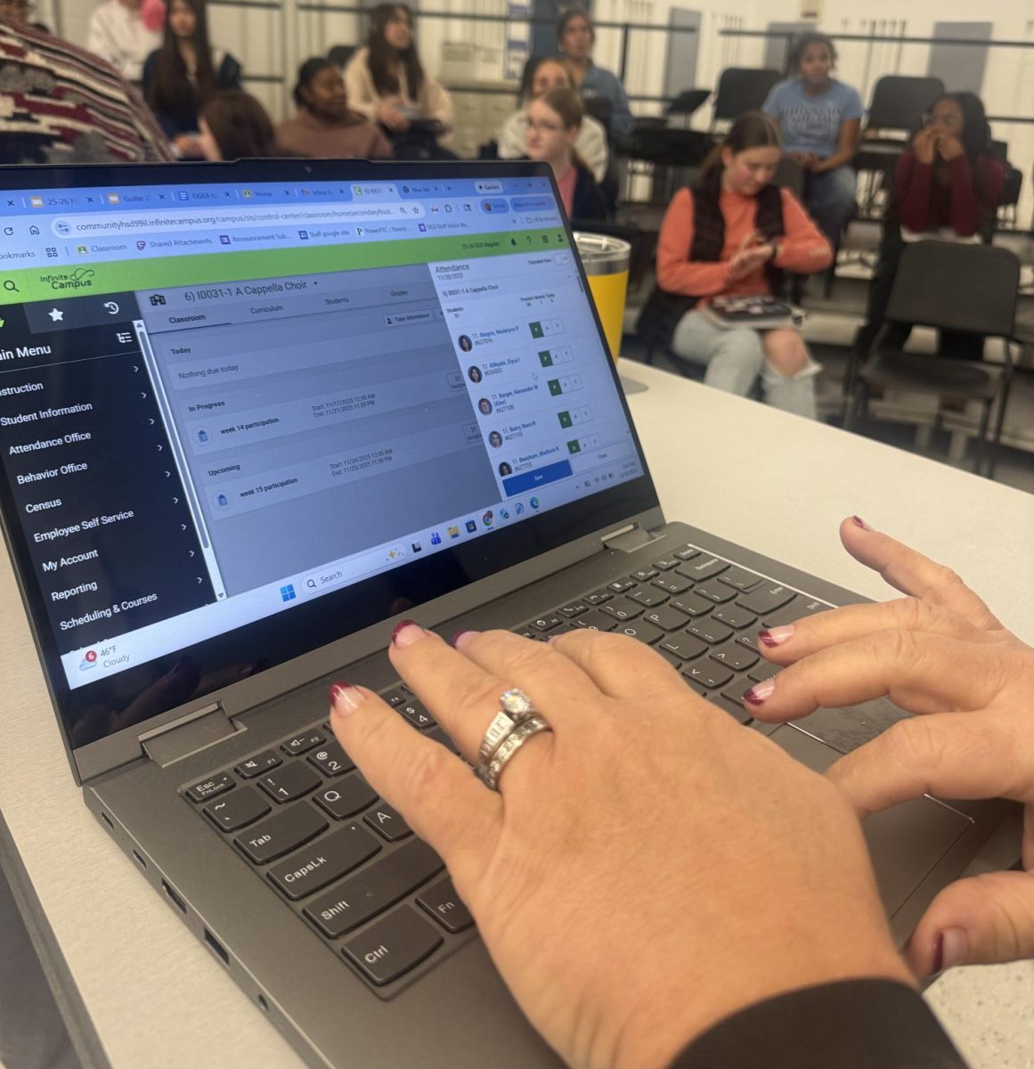 Choir director Joy Belt-Roselieb is seen taking attendance in the Infinite Campus system at the start of a capella choir.
