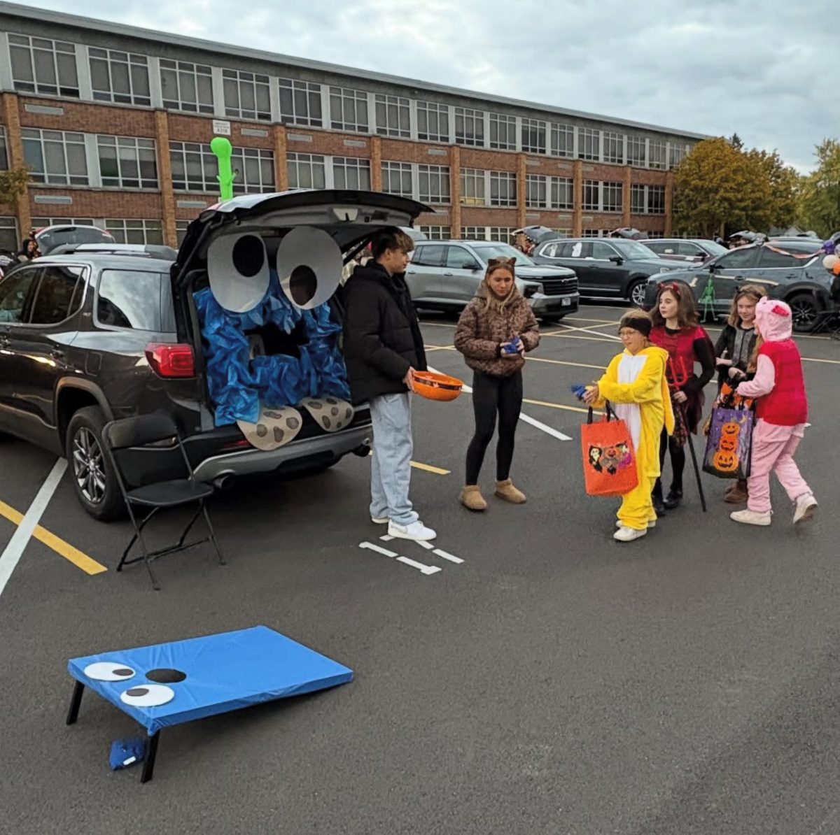 President Gabija passes out candy to the community during its annual 'Trunk or Treat'