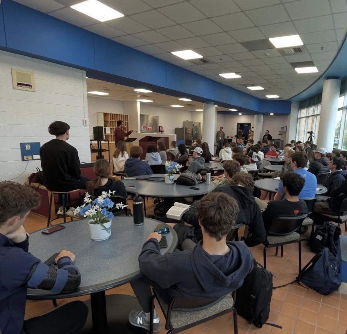 The Base listening to guest speaker to uplift them to do better in school