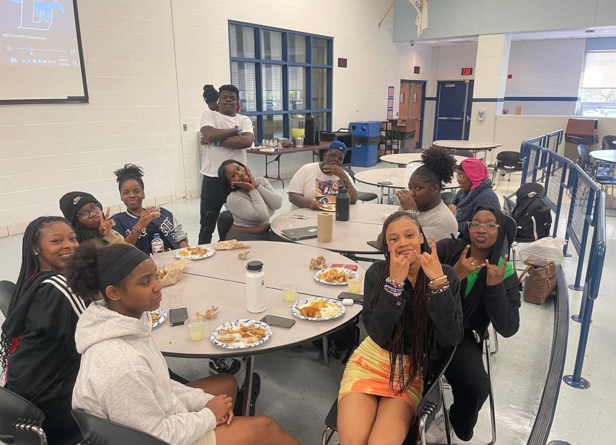 Students enjoying their last meeting with food for the school year of 2022-2023