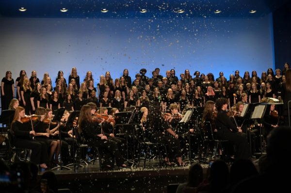 Snow cascades down from the ceiling of the Performing Arts Center as the concert draws to a close with the Orchestra Winds, Strings and Combined choirs perform 'Winter Wonderland of Snow' by Felix Bemard & Jules Styne.