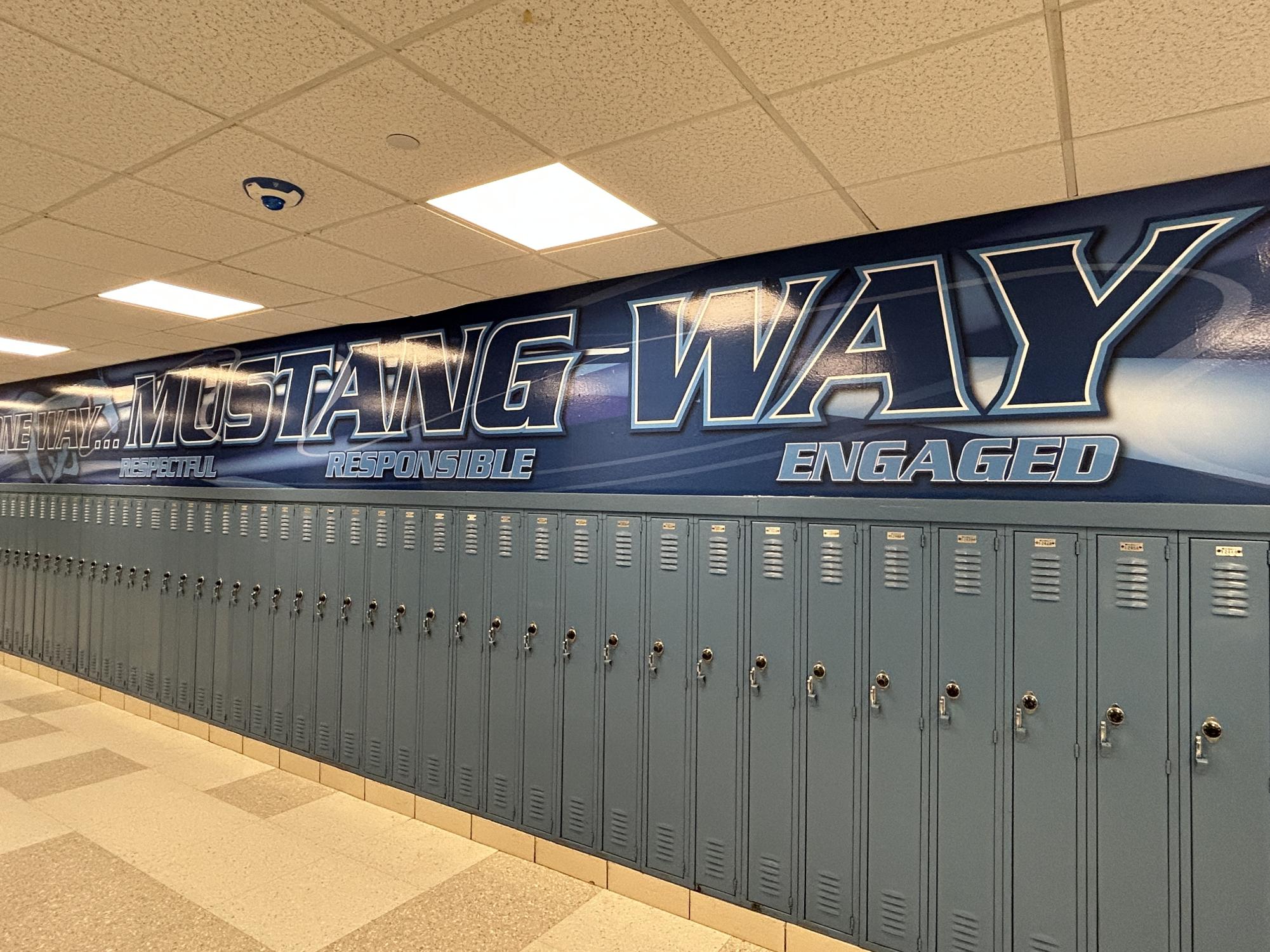 The banner with DGS' motto painted banner sits above over multiple hallways and throughout the school