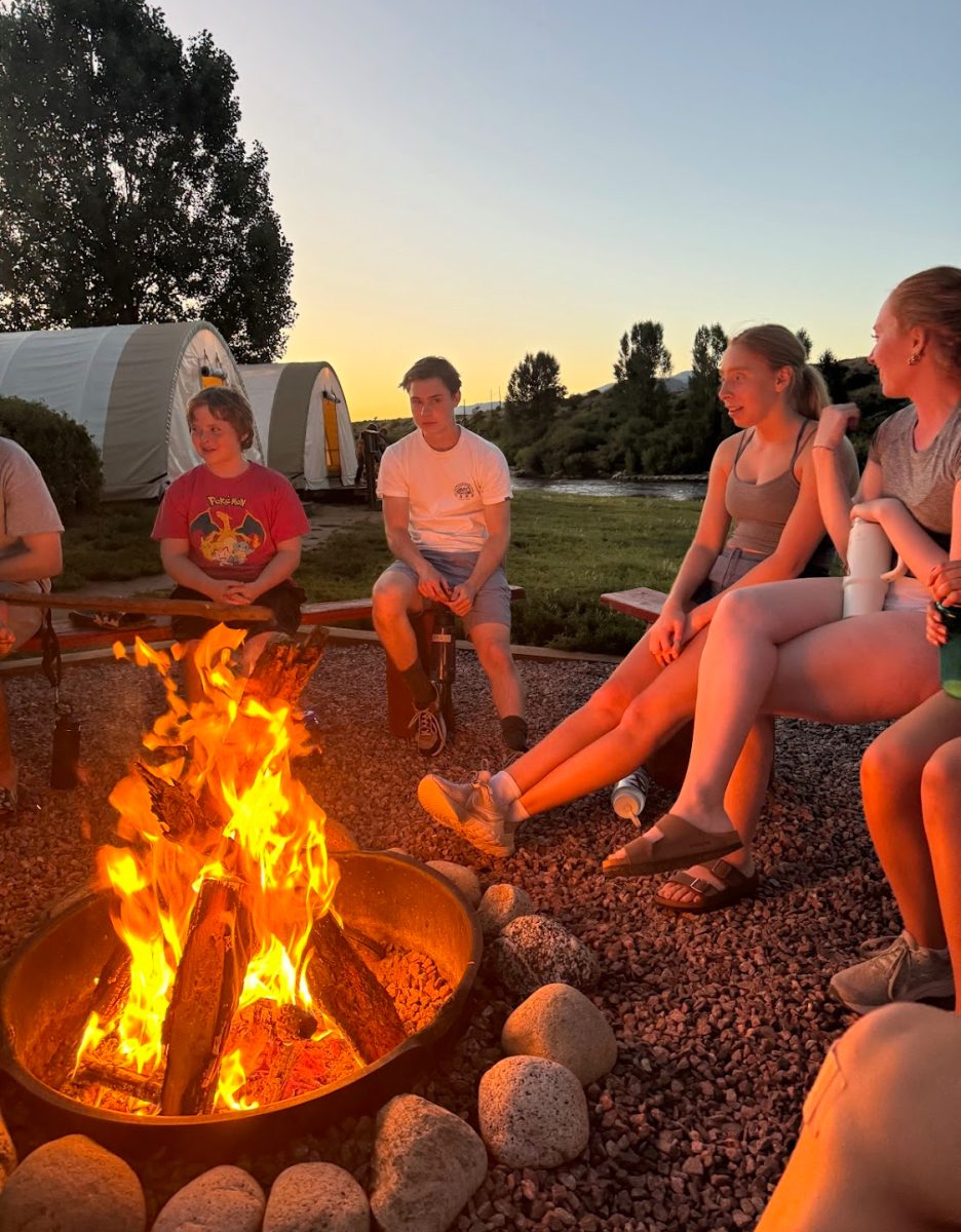 The First Congregational United Church of Christ youth group gathers around a bonfire in Colorado.