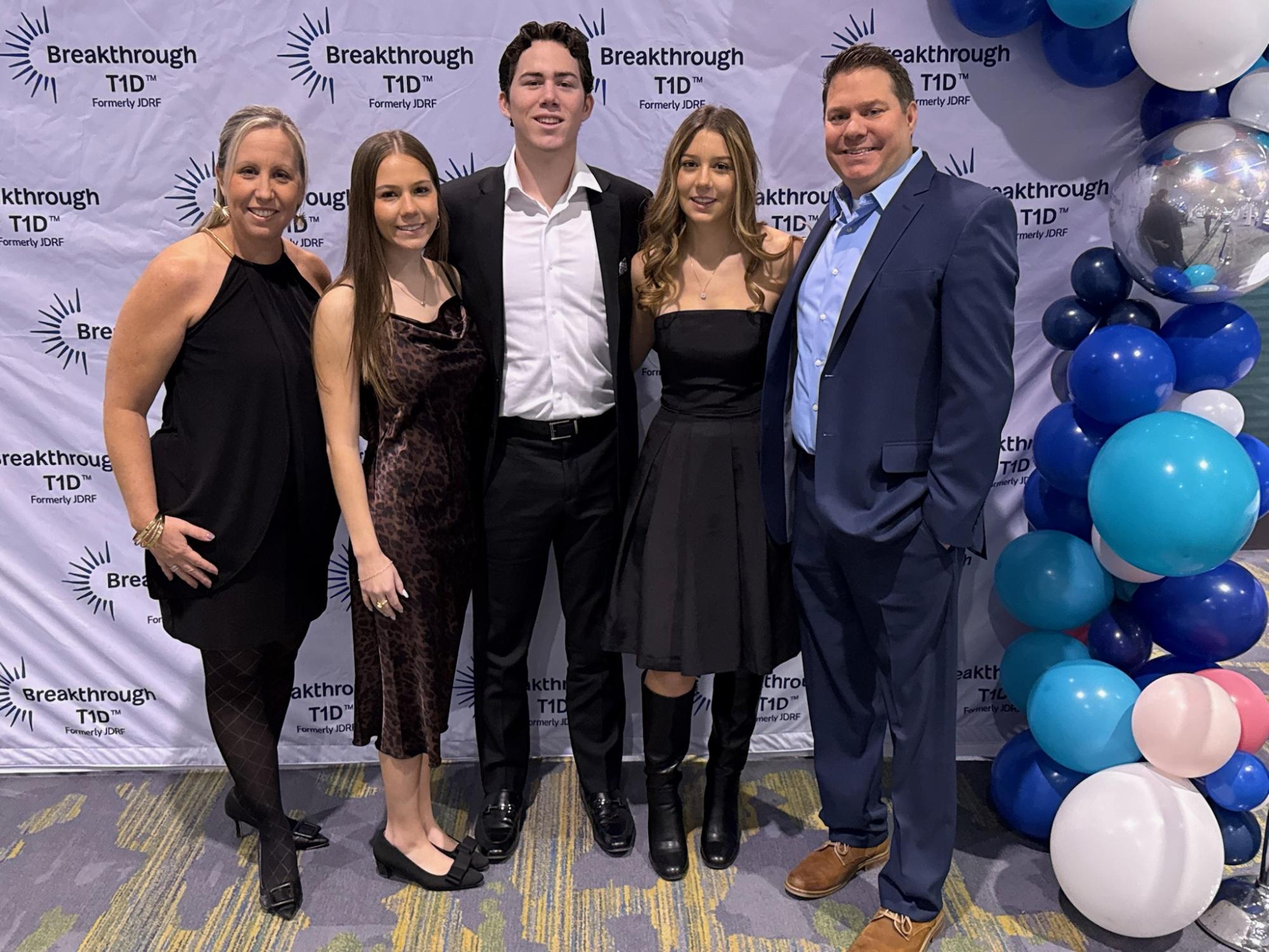 Writer Grace Lube and her family pose at the Breakthrough T1D Gala in December 2025, volunteering for a cure for Type 1 Diabetes in which her brother lives with.