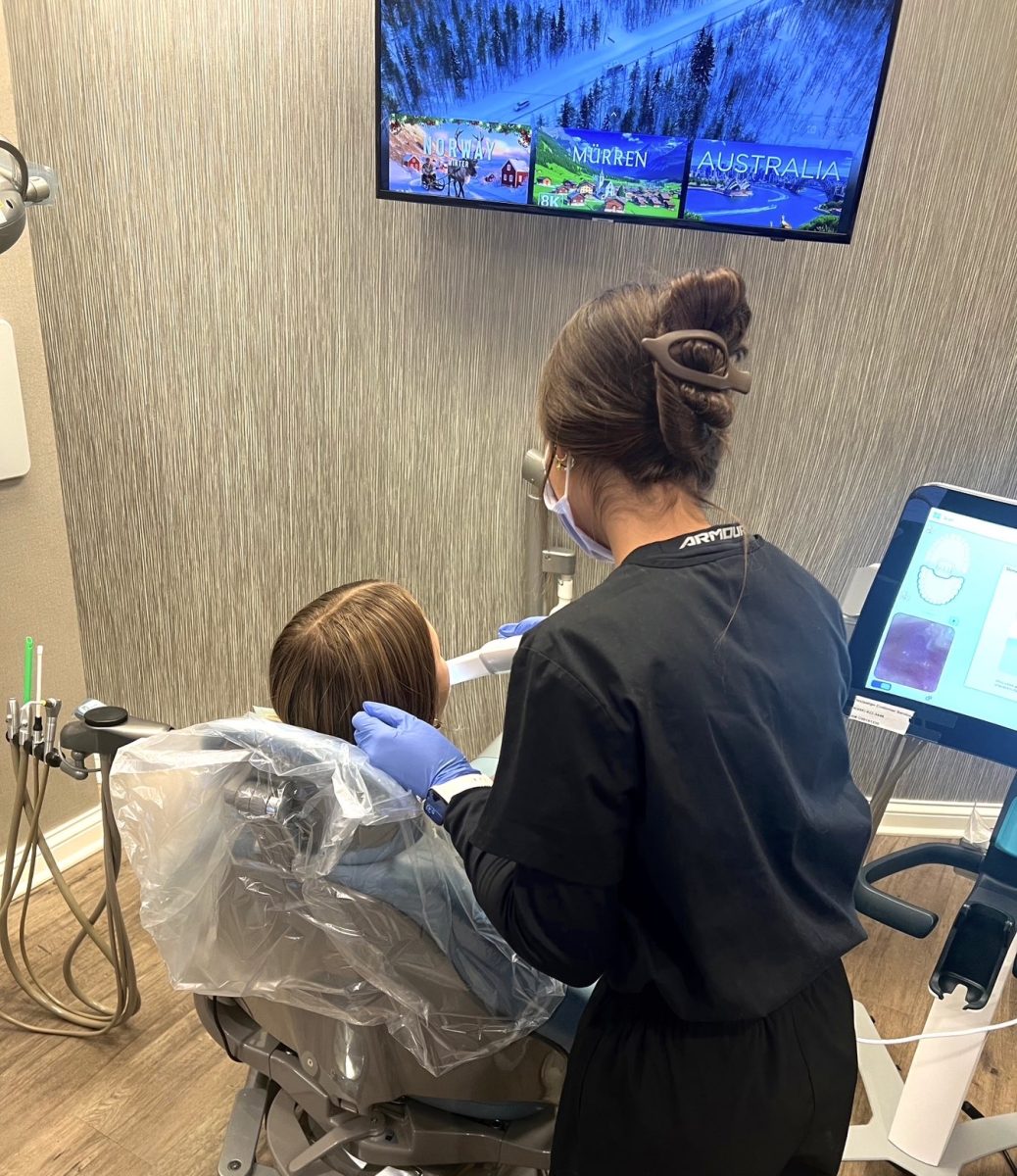 Senior Bella Del Toro featured performing a teeth x-ray during her internship at Willowbrook Family Dental. 