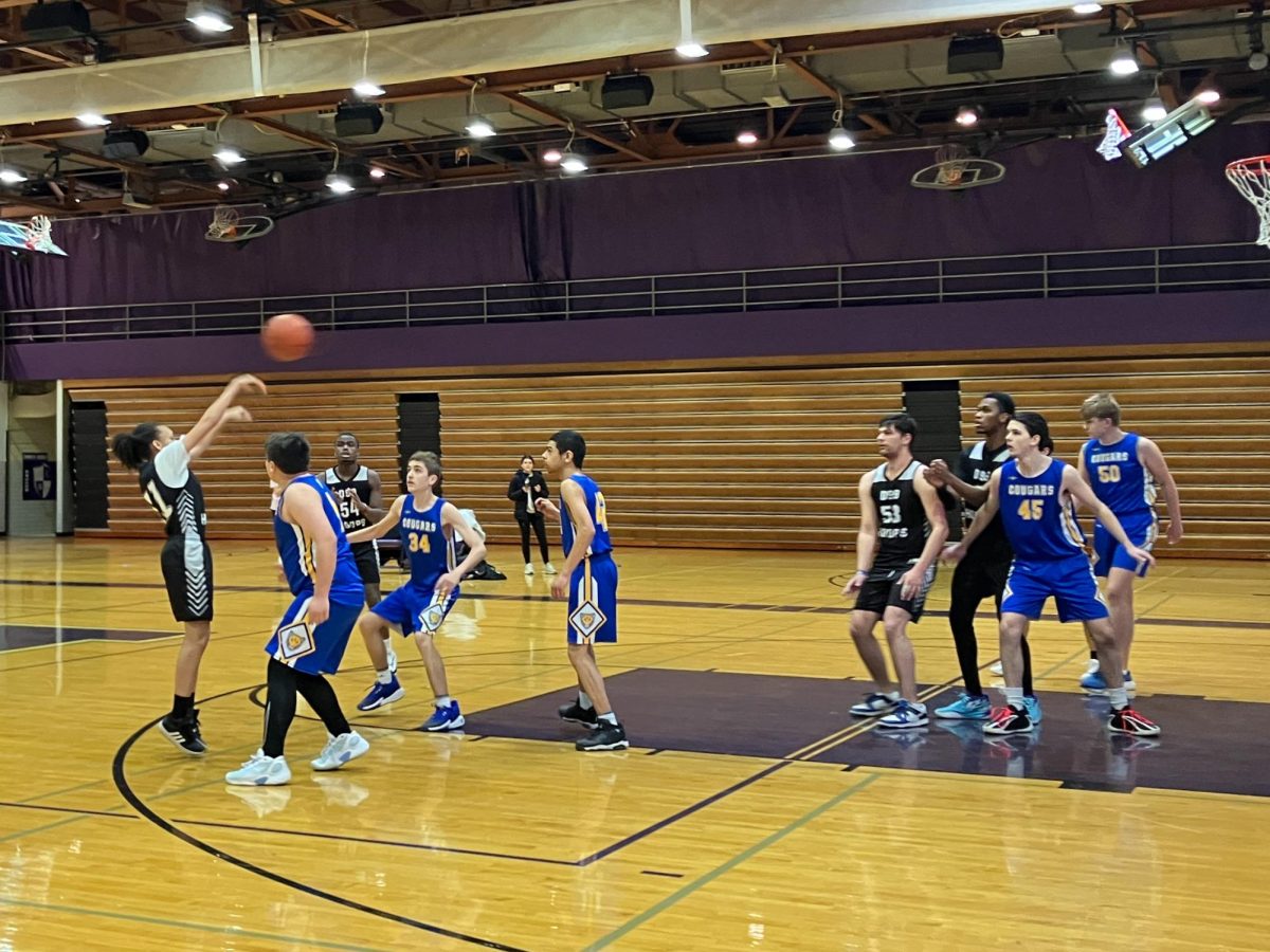 Junior Angel Martinek passes to her teammate during Team One's game on senior night, Jan. 29.