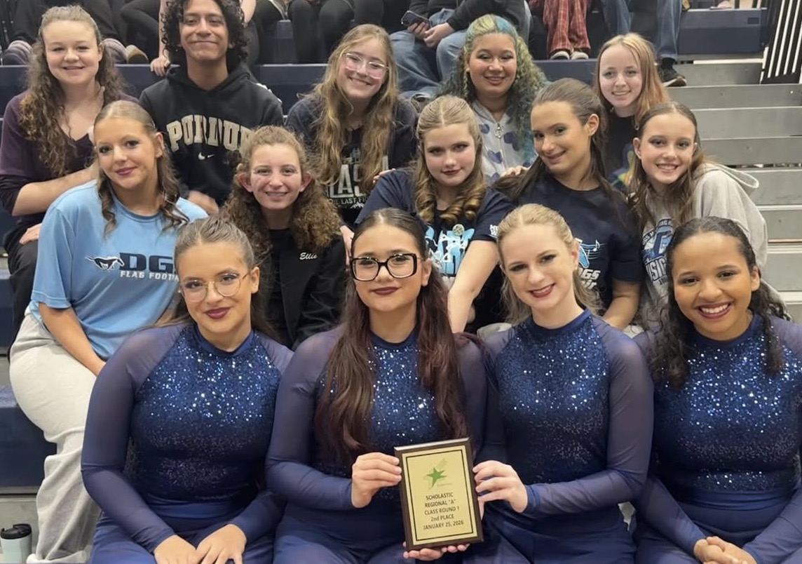 DGS winter guard poses with plaque after being awarded 2nd place at the Steperettes Contest held at Naperville North High School.