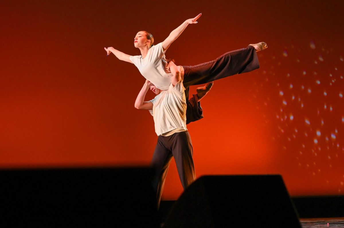 Seniors Avery Bishop and Sarah Born perform in a duet during the first act of the dance showcase.