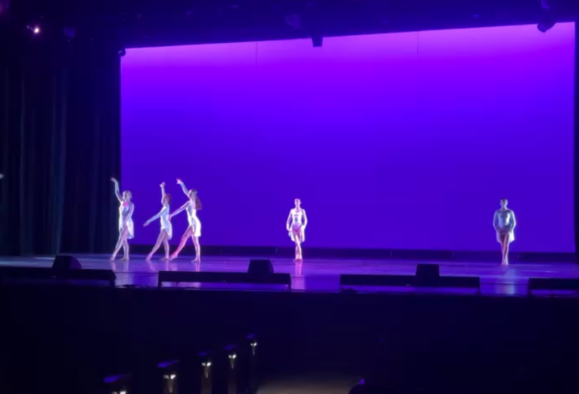 Orchesis dancers practice their routine during tech week.
