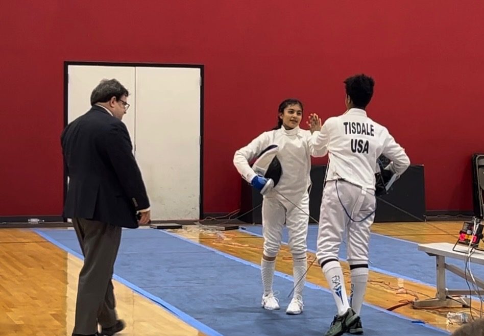 Higa faces off with a competitor moments before they compete against each other.