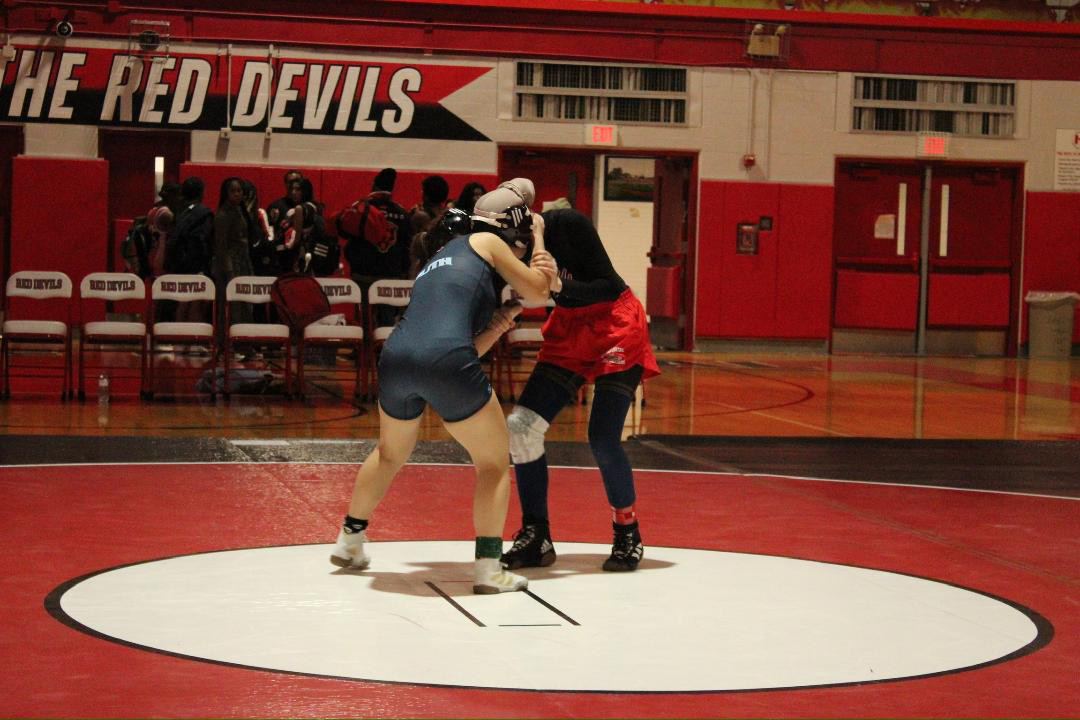 DGS wrestler Cassiel Chavez competes in a match against Hinsdale Central, reflecting Trump's competitive and athletic vision for The Patriot Games.