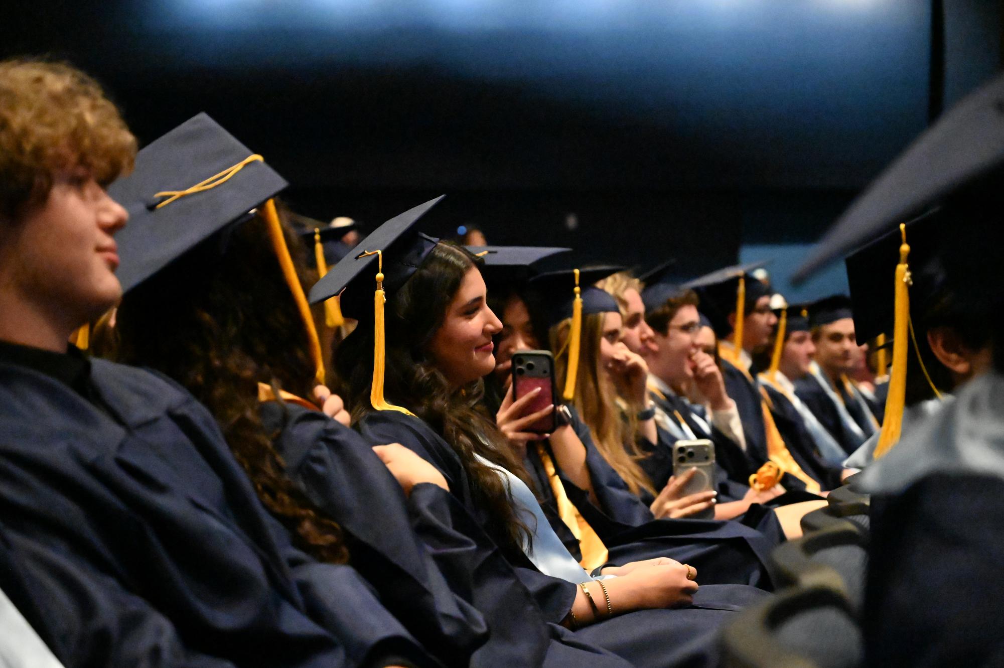Surrounded by her friends, Romina Papavero-Gonzalez is presented with an outstanding senior award.
