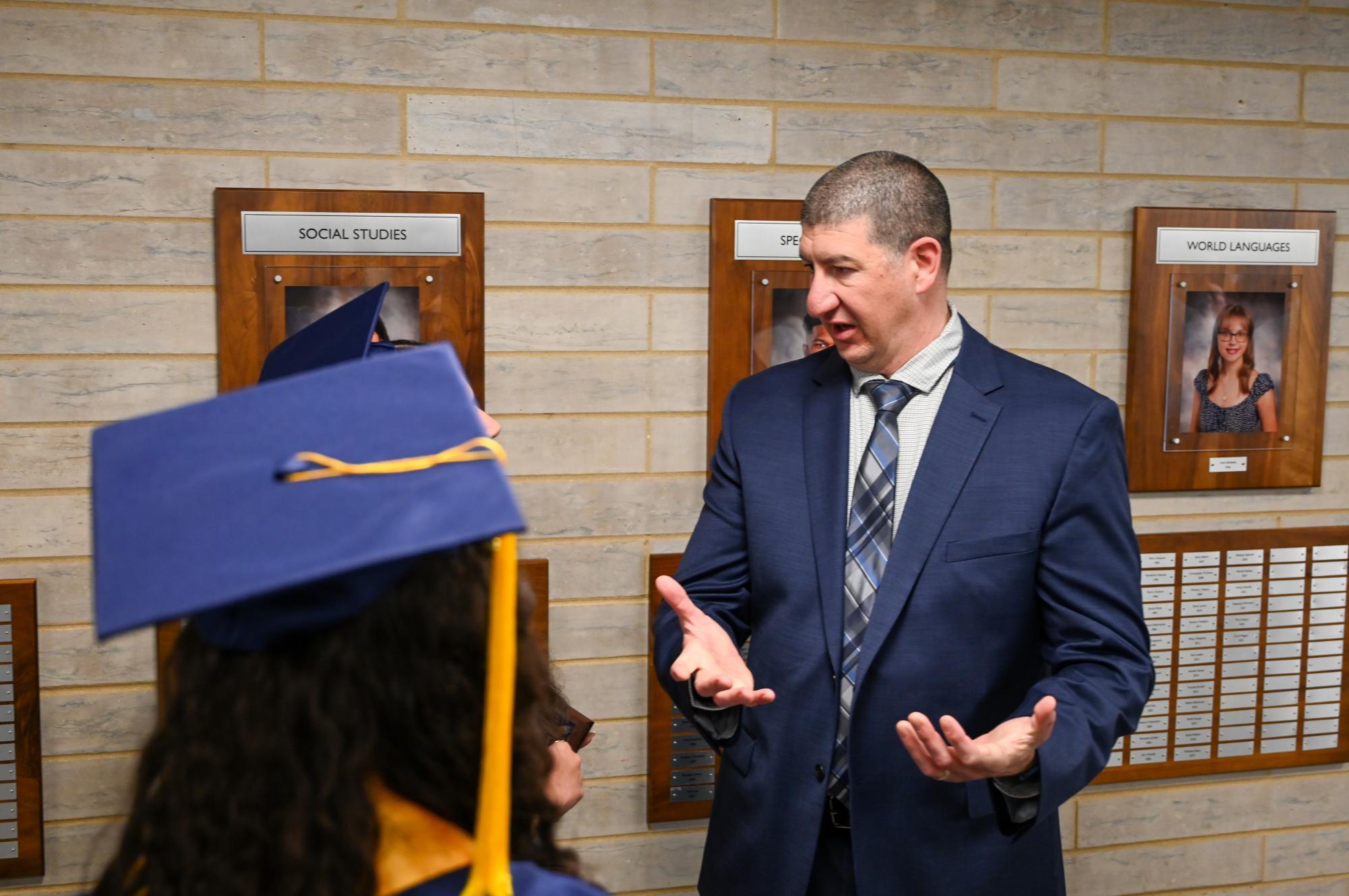 Dr Christopher Esposito speaks to two the outstanding senior in social studies, Romina Papavero-Gonzalez after the awards ceremony.
