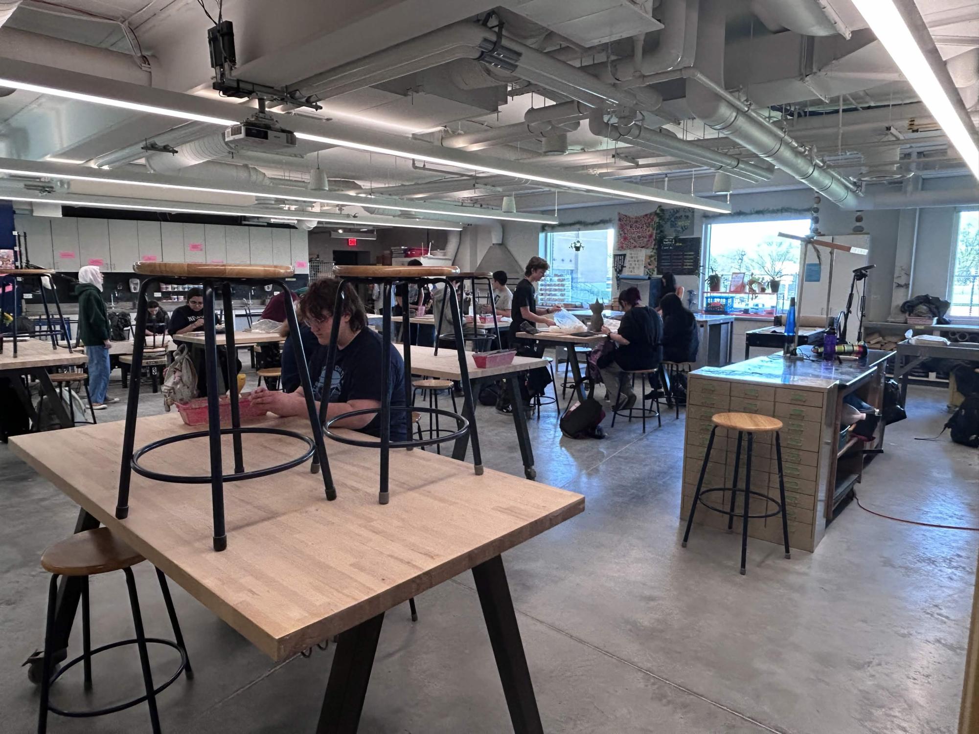 Students spread out around the clay club classroom, diligently crafting their clay artwork