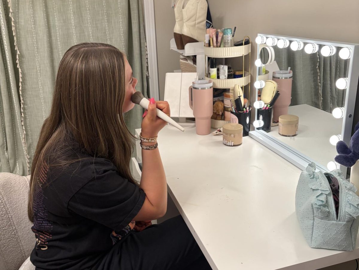Sophomore Claire Zimmerman applies her makeup before school